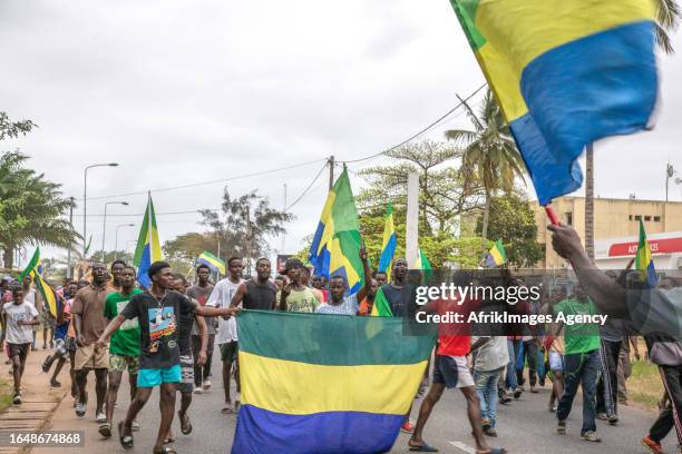 Gabonese people rejoicing in a street in Port-Gentil , on August 30, 2023 after the announcement of the Coup d'Etat perpetrated by the Gabonese...