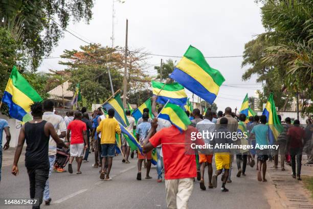 Gabonese people rejoicing in a street in Port-Gentil , on August 30, 2023 after the announcement of the Coup d'Etat perpetrated by the Gabonese...