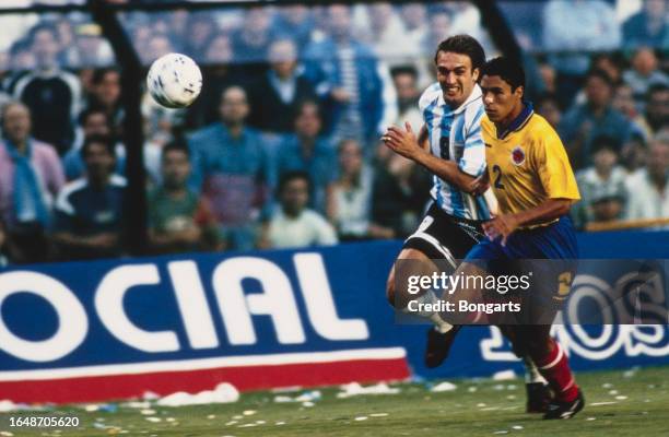 Argentine footballer Gabriel Batistuta and Colombian footballer Ivan Cordoba chasse down possession during the 1998 FIFA World Cup qualification,...