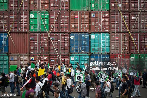 More than 100 dock workers stage a protest over pay at the Kwai Chung Container Terminal on March 29, 2013 in Hong Kong, China. The workers, who are...