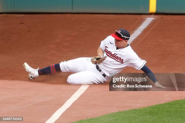 Will Brennan of the Cleveland Guardians makes a sliding catch to get out Willi Castro of the Minnesota Twins during the second inning at Progressive...