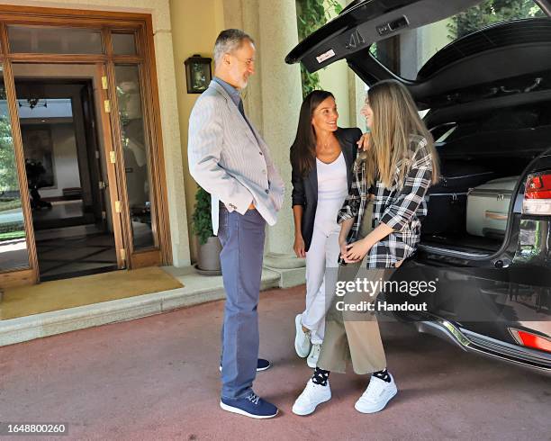 In this handout image provided by the Royal Household, King Felipe of Spain and Queen Letizia of Spain are seen talking with Princess Sofia before...