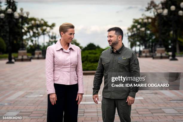 Denmarks Prime Minister Mette Frederiksen stands with Ukrainian President Volodymyr Zelensky prior to a press conference outside the Presidential...