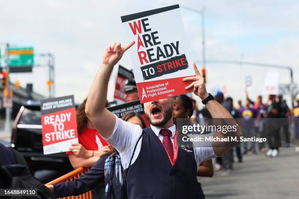 American Airlines flight attendants picket at Terminal B at LaGuardia Airport on August 30, 2023 in the Queens borough of New York City. The flight...