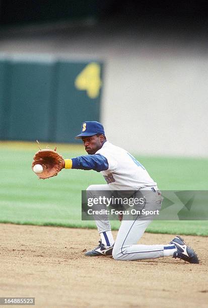 Harold Reynolds of the Seattle Mariners fields ground ball during batting practice before a Major League Baseball game against the Oakland Athletics...