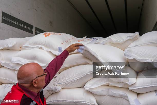 Member of the Red Crescent shows bags of flour on August 30, 2023 in Aghdam, Azerbaijan. 40 tons of humanitarian aid dispatched by the Azerbaijan Red...