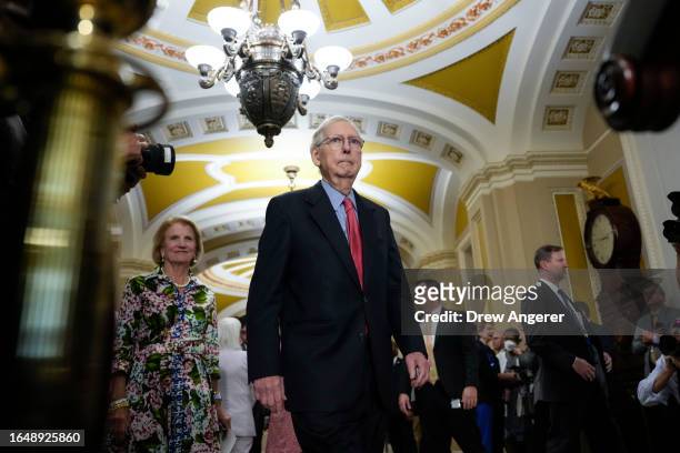 Senate Minority Leader Mitch McConnell arrives for a news conference following a closed-door lunch meeting with Senate Republicans at the U.S....