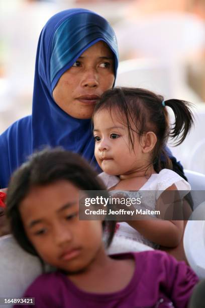 People, displaced by continuing armed conflict between the supporters of Philippine Muslim clan Sulu Sultan Jamalul Kiram III and Royal Malaysian...