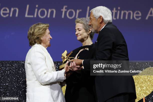 Liliana Cavani, Charlotte Rampling and President of the Venice Biennale Roberto Cicutto on stage at the opening ceremony at the 80th Venice...