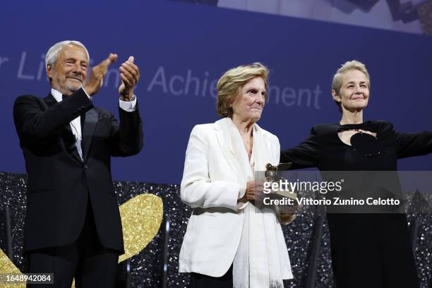 President of the Venice Biennale Roberto Cicutto, Liliana Cavani with the Golden Lion For Lifetime Achievement and Charlotte Rampling on stage at the...