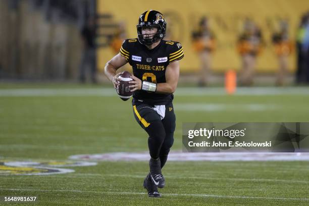 Taylor Powell of the Hamilton Tiger-Cats looks to pass against the Edmonton Elks at Tim Hortons Field on August 17, 2023 in Hamilton, Canada.