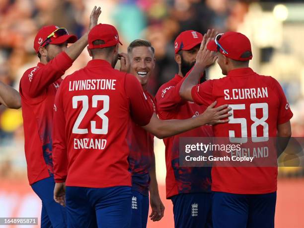 Luke Wood of England celebrates with teammates after dismissing Glenn Phillips of New Zealand during the 1st Vitality T20 International between...