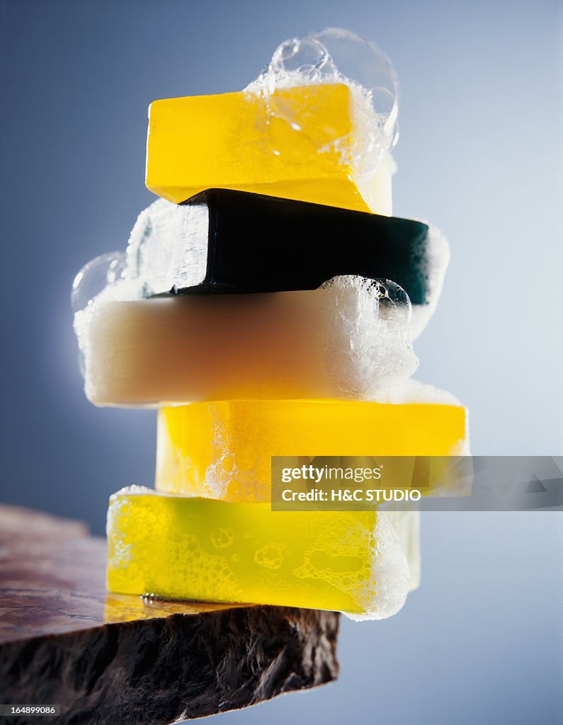 Stack of soap bars with bubbles