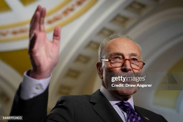 Senate Majority Leader Chuck Schumer speaks during a news conference following a closed-door lunch meeting with Senate Democrats at the U.S. Capitol...