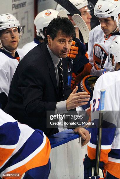 Head coach Jack Capuano of the New York Islanders speaks to the players during a NHL game against the New York Islanders at the BB&T Center on March...