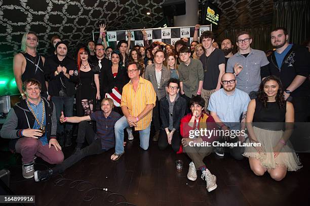 Vans Warped Tour founder Kevin Lyman and the 2013 performers pose at the Vans Warped Tour press conference and kick-off party at Club Nokia on March...