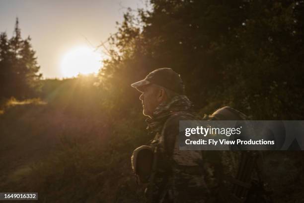 man hunting elk in the pacific northwest at sunrise - deer stock pictures, royalty-free photos & images