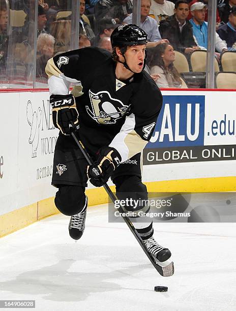 Mark Eaton of the Pittsburgh Penguins moves the puck against the Montreal Canadiens on March 26, 2013 at Consol Energy Center in Pittsburgh,...