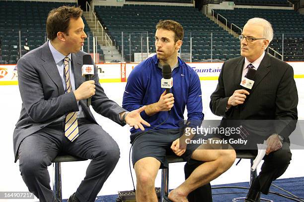 Andrew Ladd of the Winnipeg Jets takes part in CBC's Hockey Night in Canada After Hours segment with hosts Elliotte Friedman and Scott Oake following...