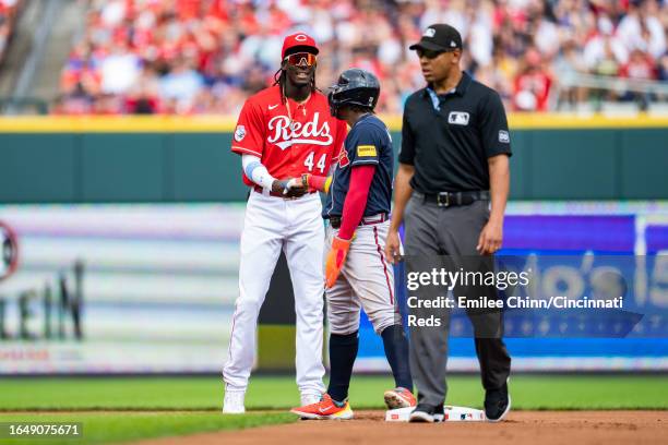 Elly De La Cruz of the Cincinnati Reds talks to Ronald Acuña Jr. #13 of the Atlanta Braves during a game at Great American Ball Park on June 24, 2023...