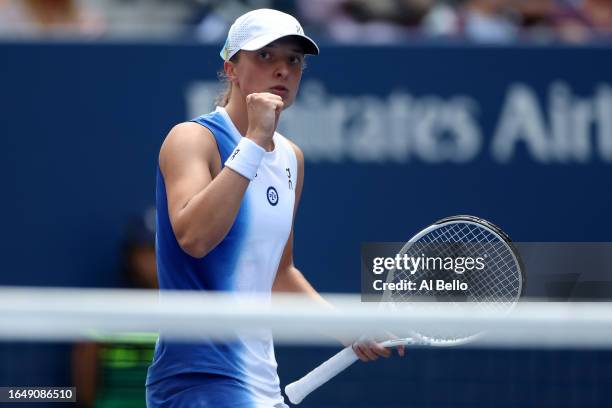 Iga Swiatek of Poland celebrates a point against Daria Saville of Australia during their Women's Singles Second Round match on Day Three of the 2023...