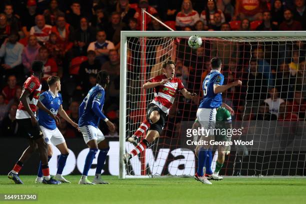 Joe Ironside of Doncaster Rovers scores the team's first goal during the Carabao Cup Second Round match between Doncaster Rovers and Everton at...