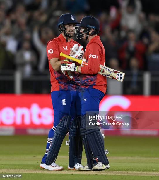 Harry Brook and Liam Livingstone of England celebrate winning the 1st Vitality T20 International between England and New Zealand at Emirates...