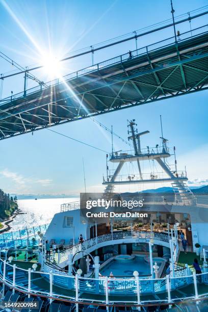 white antennas and lions gate bridge, vancouver, canada - vancouver lions gate stock pictures, royalty-free photos & images