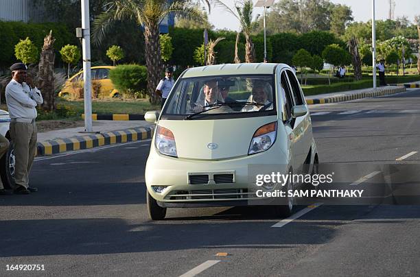 Congressman and Republican member of the House of Representatives from Illinois, Aaron Schock drives a TATA NANO car during the US delegation visit...