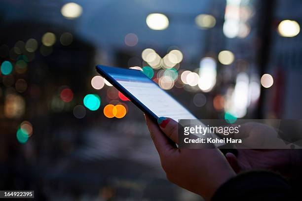 a woman using a digital tablet - ipad touching stock pictures, royalty-free photos & images