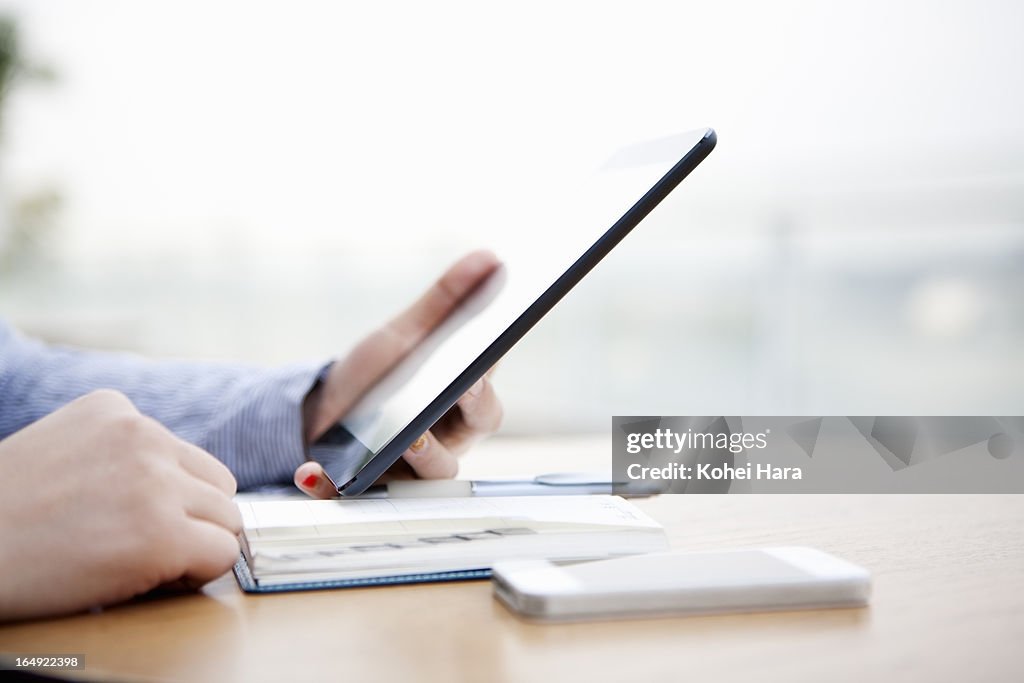 A business woman using a digital tablet