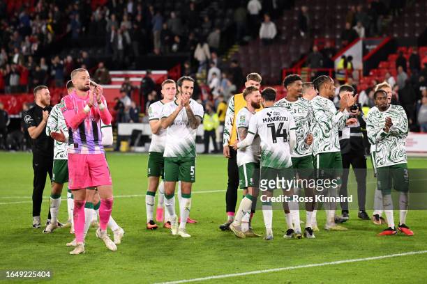 The players of Lincoln City applaud the fans following victory in the penalty shoot out after the Carabao Cup Second Round match between Sheffield...