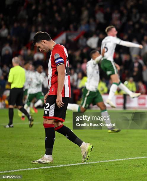 John Egan of Sheffield United looks dejected after missing their sides fifth and final penalty in the penalty shoot out during the Carabao Cup Second...