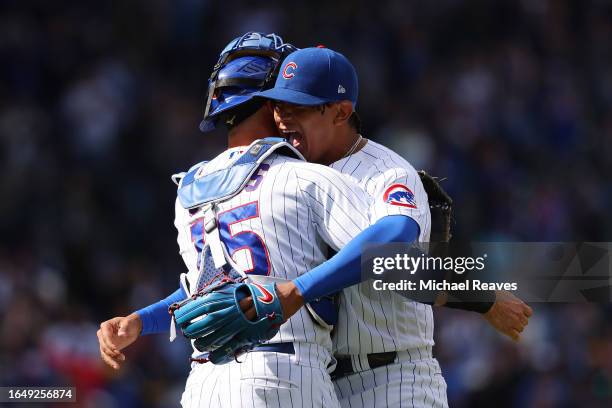 Adbert Alzolay of the Chicago Cubs celebrates with Yan Gomes after the final out to defeat the Milwaukee Brewers 3-2 at Wrigley Field on August 30,...