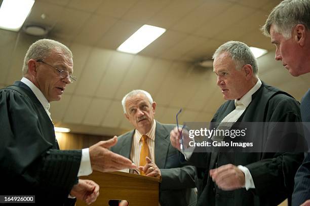 Advocate Gerrie Nel, Kol Botha, Advocate Barry Roux and Brian Webber during Oscar Pistorius' bail hearing at Pretoria Magistrates Court on March 28...