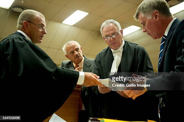Advocate Gerrie Nel, Kol Botha, Advocate Barry Roux and Brian Webber during Oscar Pistorius' bail hearing at Pretoria Magistrates Court on March 28...