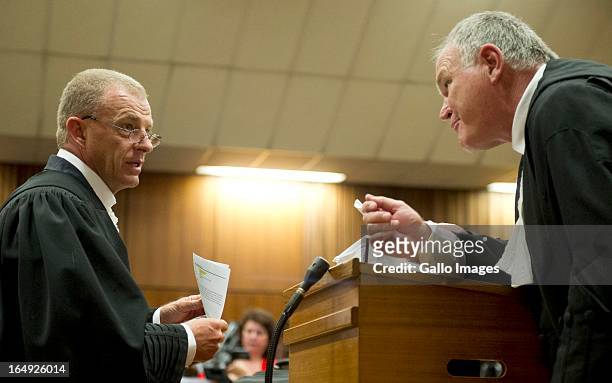 Advocate Gerrie Nel and Advocate Barry Roux during Oscar Pistorius' bail hearing at Pretoria Magistrates Court on March 28 in Pretoria, South Africa....