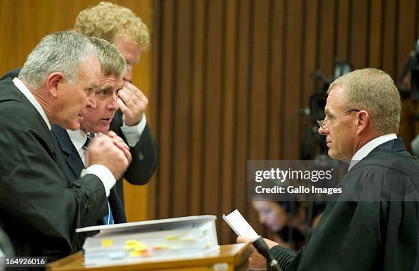 Advocate Barry Roux, Brian Webber, Andrew Fawcett and Advocate Gerrie Nel during Oscar Pistorius' bail hearing at Pretoria Magistrates Court on March...