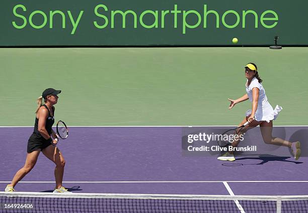 Laura Robson of Great Britain and Lisa Raymond in action against Sara Errani and Roberta Vinci of Italy during their semi final doubles match at the...