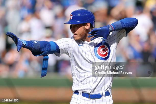 Cody Bellinger of the Chicago Cubs celebrates a go-ahead RBI single during the eighth inning against the Milwaukee Brewers at Wrigley Field on August...
