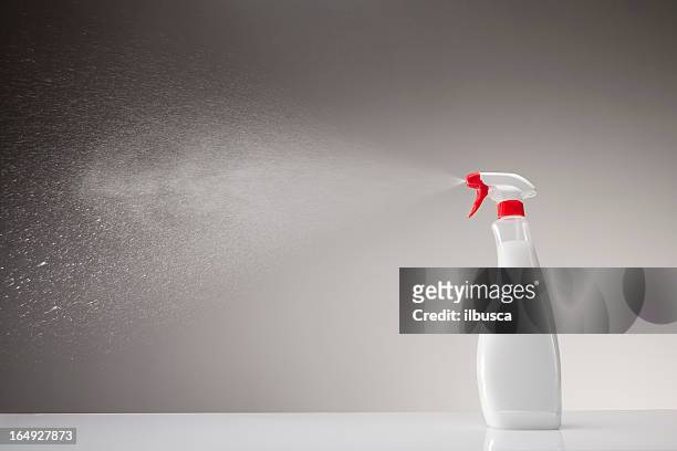 spray bottle studio shot on gray gradient background - spuit stockfoto's en -beelden