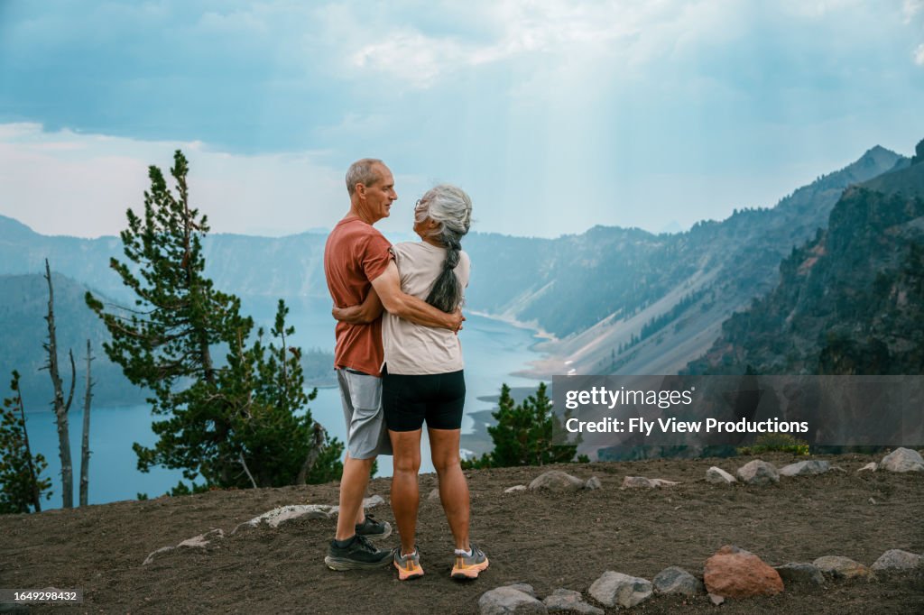 Active senior couple enjoying scenic view while on a hike