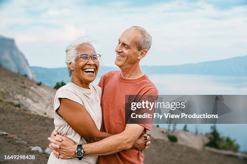 Joyful retired couple hiking