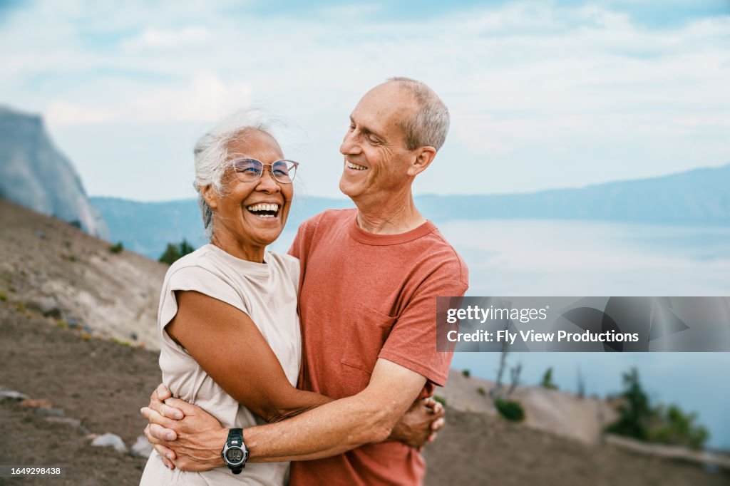 Joyful retired couple hiking