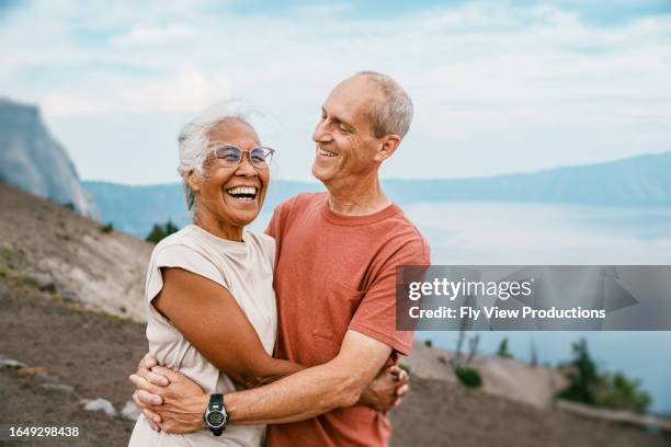 joyful retired couple hiking - pacific northwest stock pictures, royalty-free photos & images