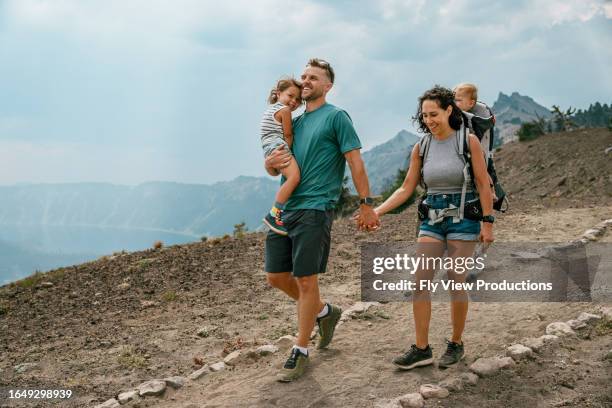 family hiking in the mountains - family active lifestyle stock pictures, royalty-free photos & images