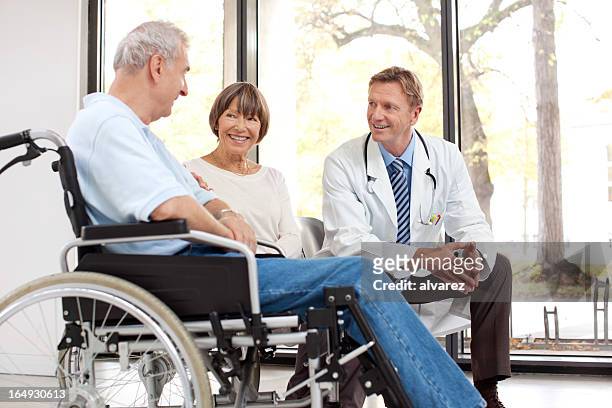 injured senior patient with wife and doctor - hhp5 stock pictures, royalty-free photos & images