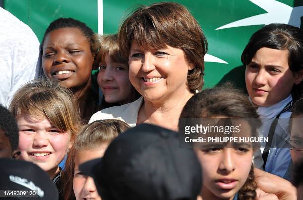 French leader of the Socialist Party and mayor of Lille, Martine Aubry poses with children, in a Sensitive urban zone of the French northern city of...