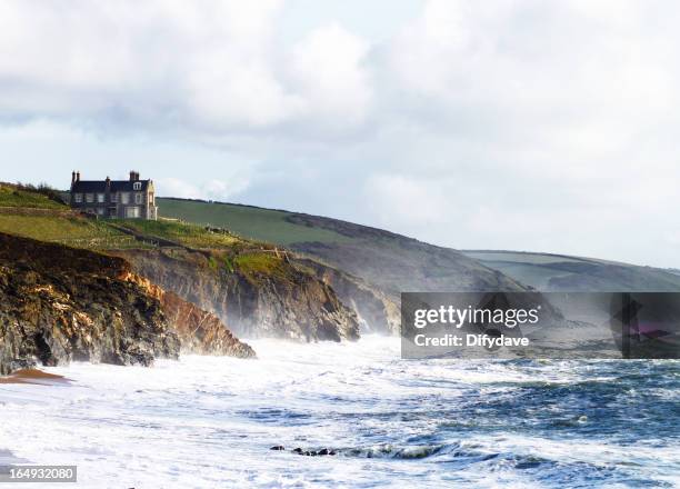 beach and cliffs at porthleven cornwall uk - cornwall engeland stockfoto's en -beelden
