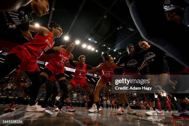 The Atlanta Dream huddle up before the game against the Seattle Storm on September 6, 2023 at Gateway Center Arena at College Park in Atlanta,...